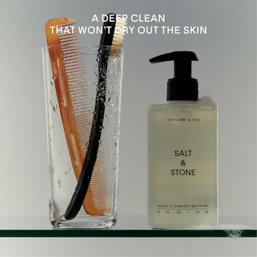 Facial cleanser beside glass with combs