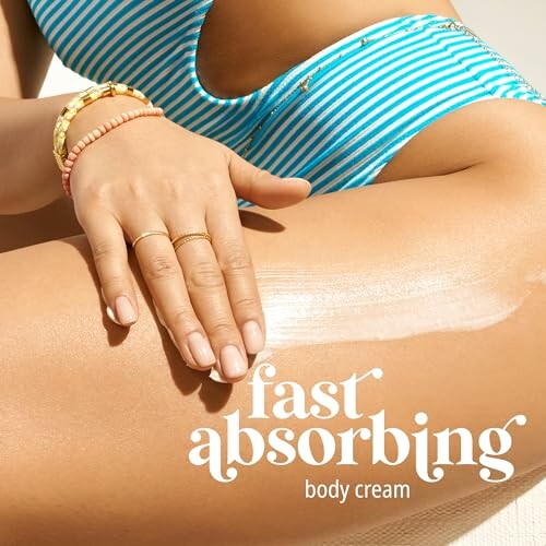 Person applying fast absorbing body cream on leg