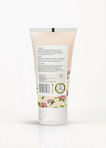 Back view of a floral hand cream tube with ingredients listed.