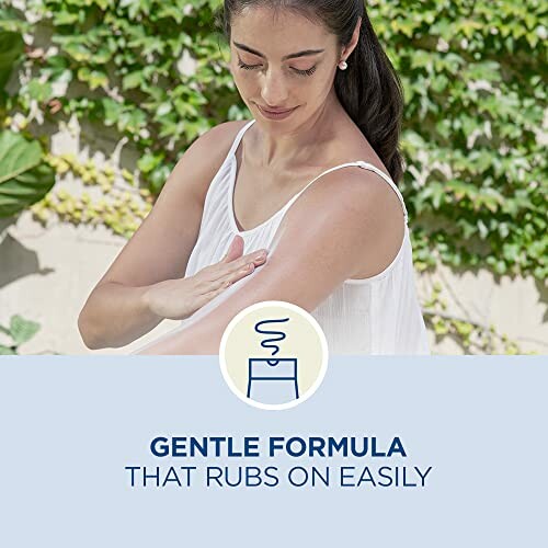 Person applying a gentle formula on their arm with text 'Gentle formula that rubs on easily'.