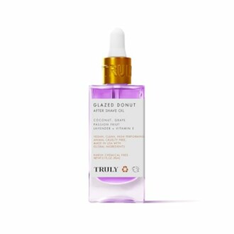 Glazed Donut After Shave Oil bottle with purple liquid.