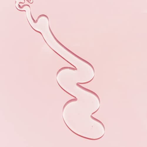 Abstract clear liquid on pink background