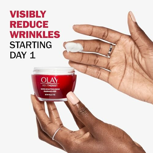 Hands holding Olay Regenerist cream with text 'Visibly reduce wrinkles starting Day 1'.