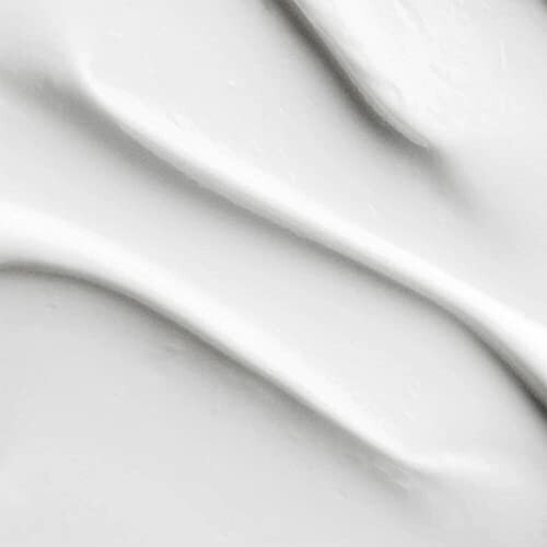 Smooth white surface with gentle folds and shadows.