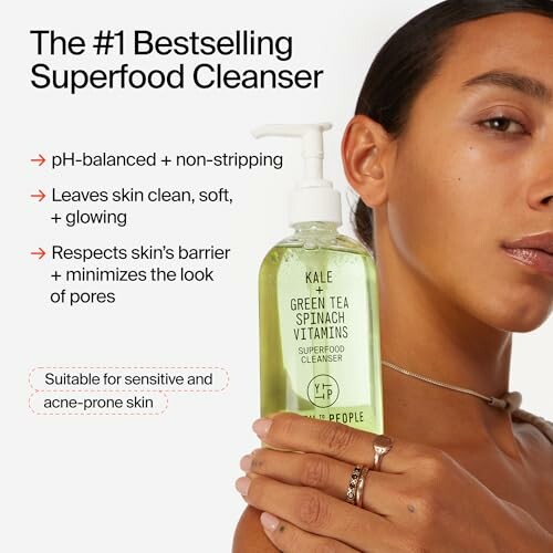 Woman holding a bottle of superfood cleanser with benefits listed.